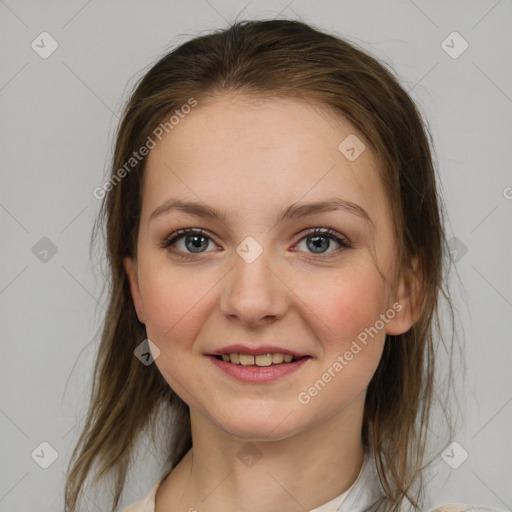 Joyful white young-adult female with medium  brown hair and grey eyes