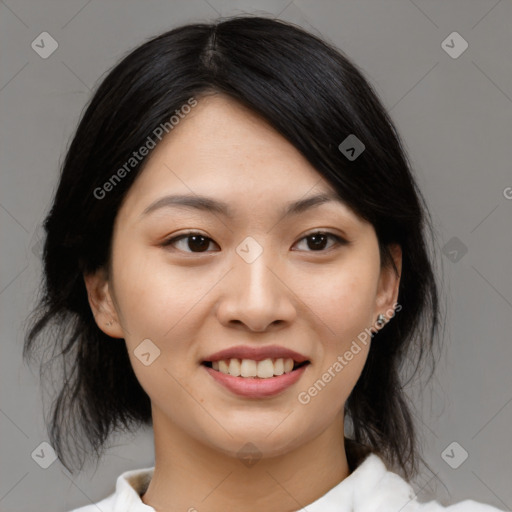 Joyful asian young-adult female with medium  black hair and brown eyes