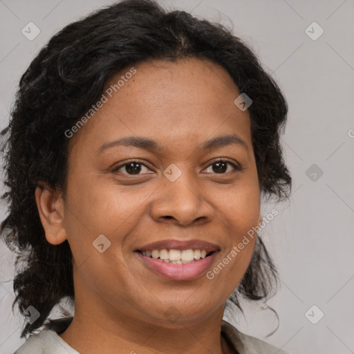 Joyful black adult female with medium  brown hair and brown eyes