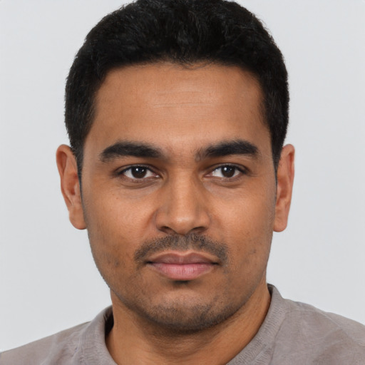 Neutral latino young-adult male with short  black hair and brown eyes