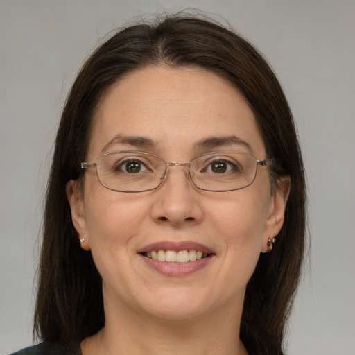 Joyful white adult female with medium  brown hair and brown eyes