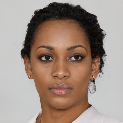 Neutral black young-adult female with short  black hair and brown eyes