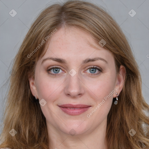 Joyful white young-adult female with long  brown hair and blue eyes