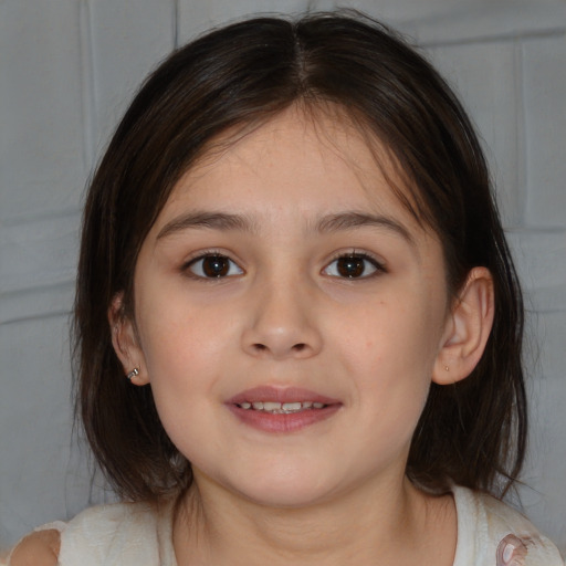 Joyful white child female with medium  brown hair and brown eyes