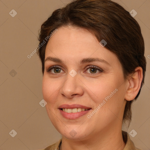 Joyful white adult female with medium  brown hair and brown eyes