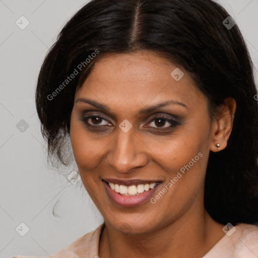 Joyful latino young-adult female with medium  brown hair and brown eyes