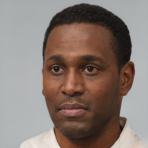 Neutral black young-adult male with short  black hair and brown eyes