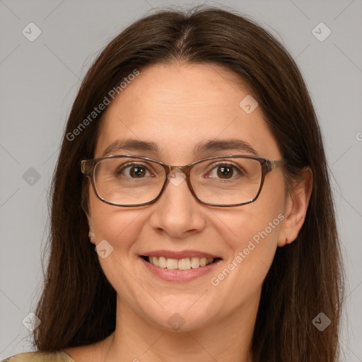 Joyful white adult female with medium  brown hair and brown eyes