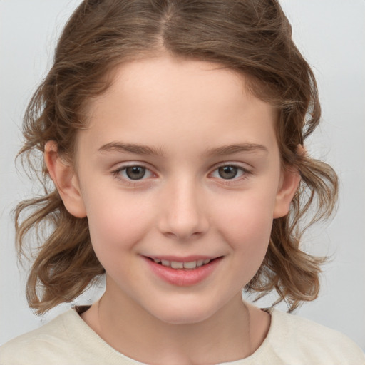 Joyful white child female with medium  brown hair and brown eyes