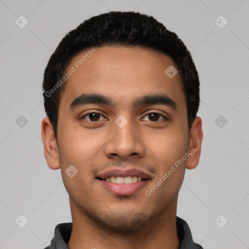 Joyful latino young-adult male with short  black hair and brown eyes