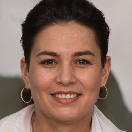 Joyful white adult female with short  brown hair and brown eyes