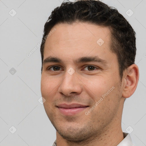 Joyful white young-adult male with short  brown hair and brown eyes