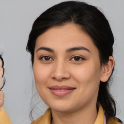 Joyful asian young-adult female with medium  brown hair and brown eyes