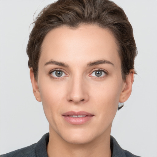 Neutral white young-adult female with short  brown hair and brown eyes