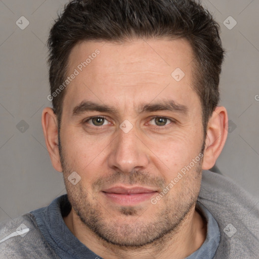 Joyful white adult male with short  brown hair and brown eyes