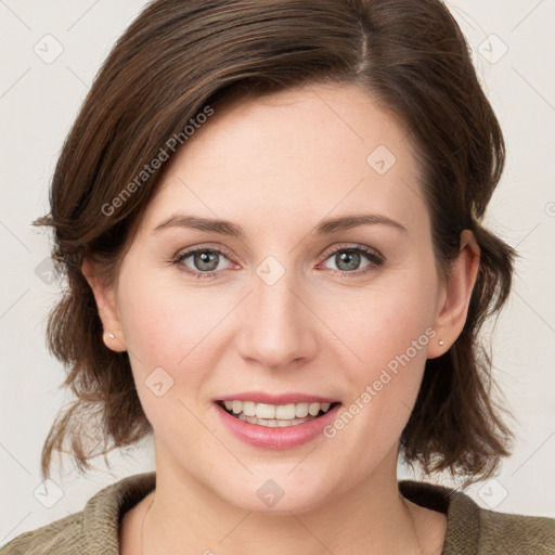 Joyful white young-adult female with medium  brown hair and blue eyes