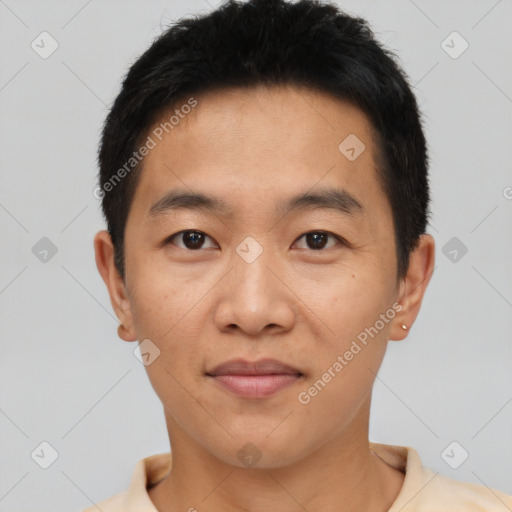 Joyful asian young-adult male with short  black hair and brown eyes