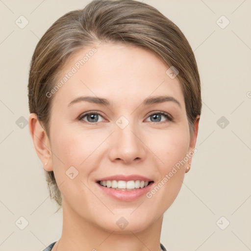 Joyful white young-adult female with short  brown hair and grey eyes