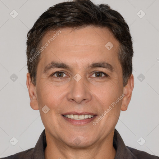 Joyful white adult male with short  brown hair and brown eyes