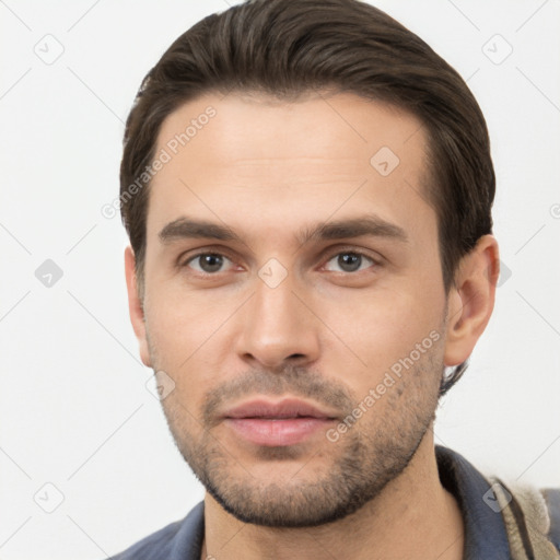 Neutral white young-adult male with short  brown hair and brown eyes