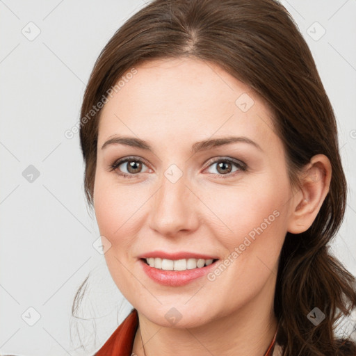 Joyful white young-adult female with medium  brown hair and grey eyes