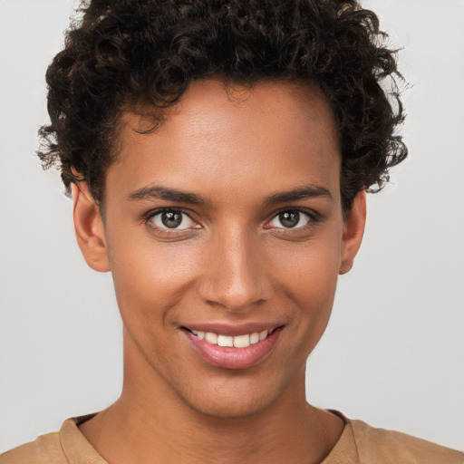 Joyful white young-adult female with short  brown hair and brown eyes