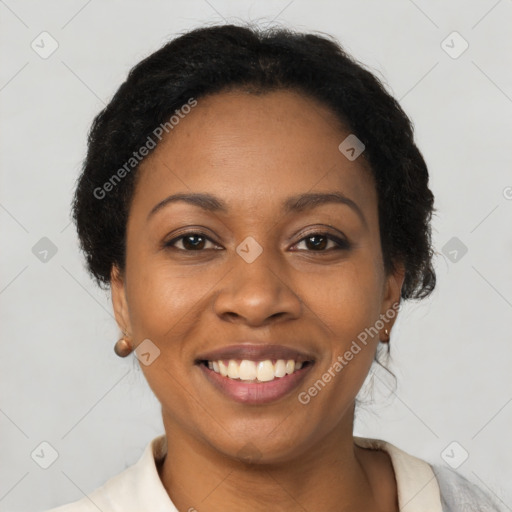 Joyful black young-adult female with short  brown hair and brown eyes