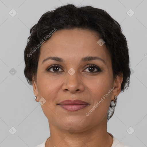 Joyful latino adult female with short  brown hair and brown eyes