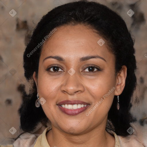 Joyful latino adult female with medium  brown hair and brown eyes