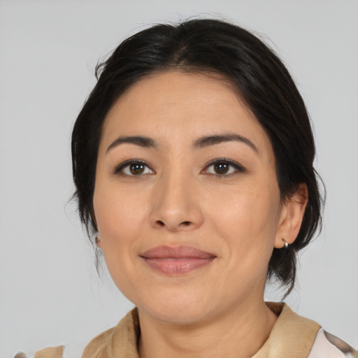 Joyful latino young-adult female with medium  brown hair and brown eyes
