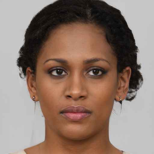 Neutral black young-adult female with short  brown hair and brown eyes