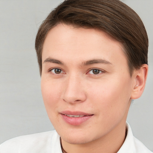 Joyful white young-adult female with short  brown hair and brown eyes