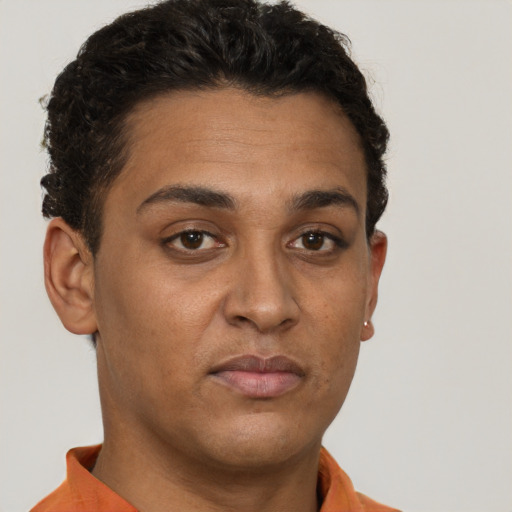 Neutral latino young-adult male with short  brown hair and brown eyes