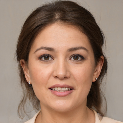 Joyful white young-adult female with medium  brown hair and brown eyes