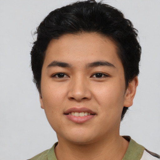 Joyful asian young-adult female with short  black hair and brown eyes