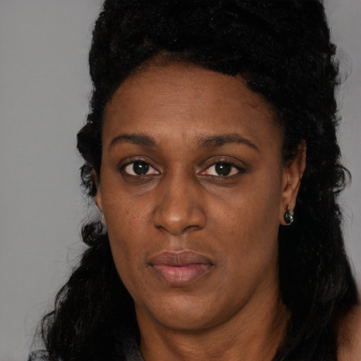 Neutral black adult female with long  black hair and brown eyes