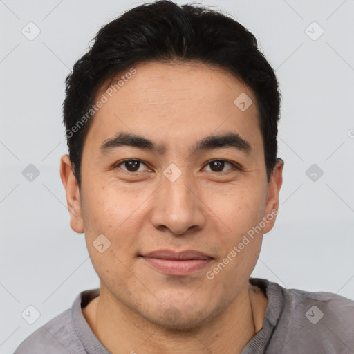 Joyful latino young-adult male with short  brown hair and brown eyes