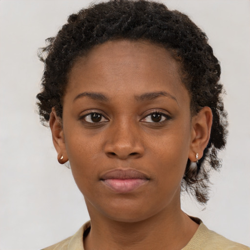 Neutral black young-adult female with short  brown hair and brown eyes