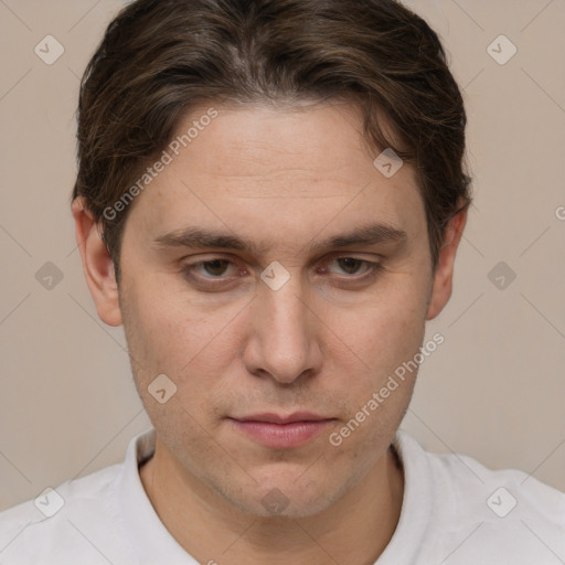 Joyful white adult male with short  brown hair and grey eyes