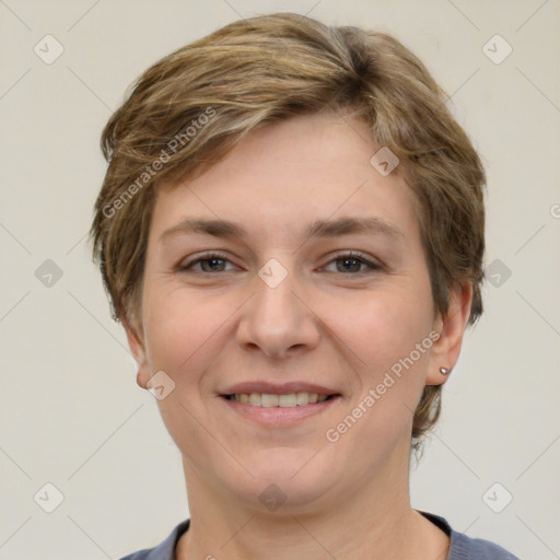 Joyful white young-adult female with short  brown hair and grey eyes