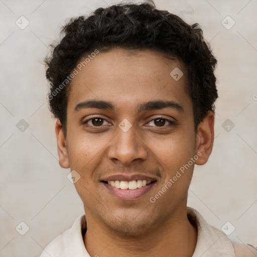 Joyful latino young-adult male with short  brown hair and brown eyes