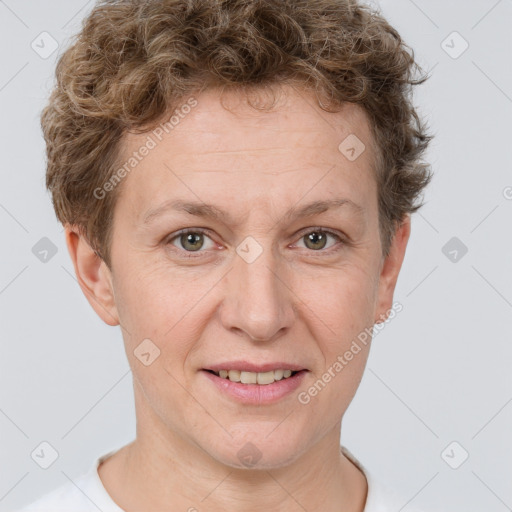 Joyful white adult female with short  brown hair and grey eyes