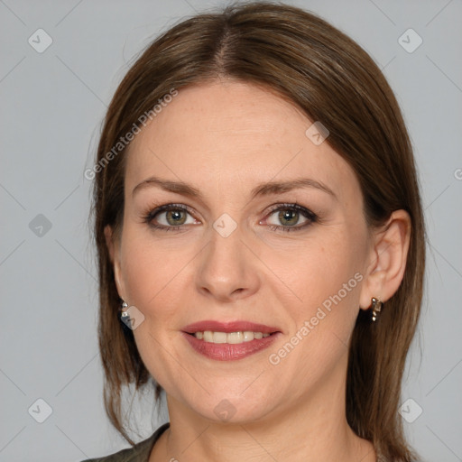 Joyful white adult female with medium  brown hair and grey eyes