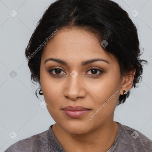 Joyful latino young-adult female with medium  black hair and brown eyes