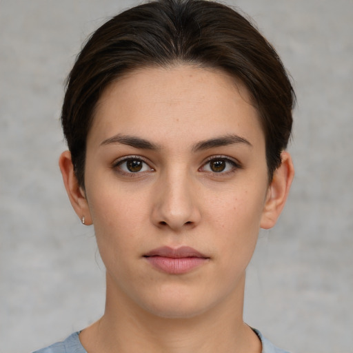 Neutral white young-adult female with short  brown hair and brown eyes