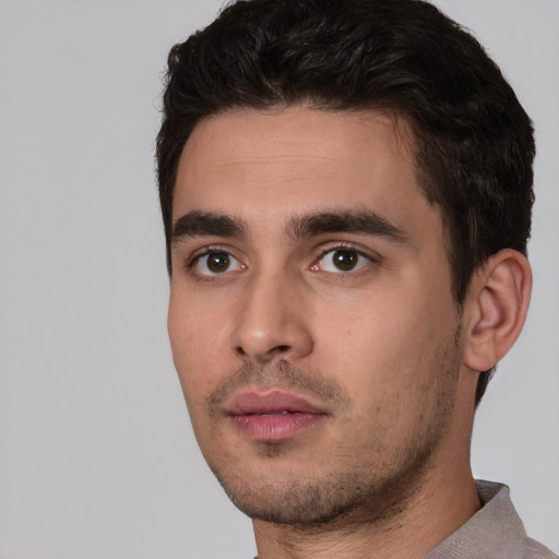 Neutral white young-adult male with short  black hair and brown eyes