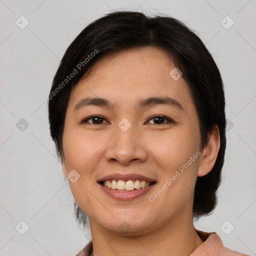 Joyful asian young-adult female with short  brown hair and brown eyes