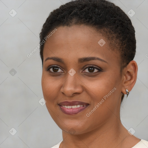 Joyful black young-adult female with short  brown hair and brown eyes