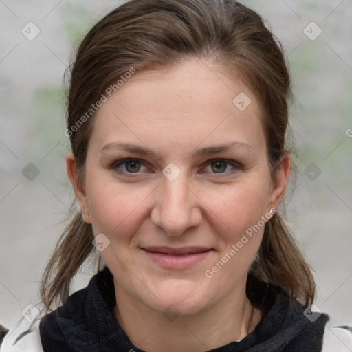 Joyful white young-adult female with medium  brown hair and grey eyes