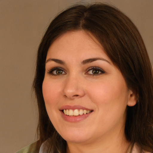 Joyful white young-adult female with medium  brown hair and brown eyes